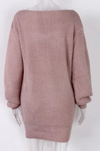 Back view of a pink off-the-shoulder ribbed knit tunic sweater on a mannequin.