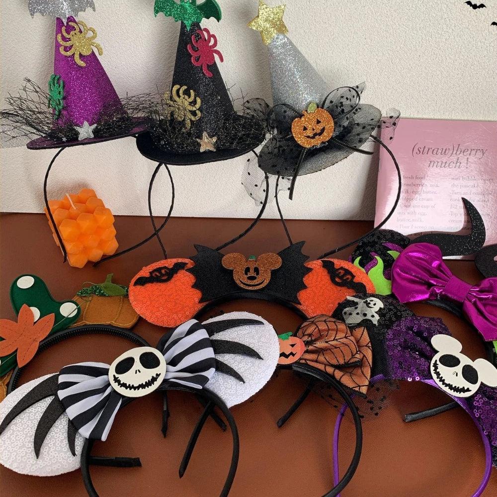 Collection of various Halloween themed headbands including Mickey ears with pumpkins, bats, and Jack Skellington designs.