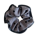 Gray polka dot scrunchie with black trim