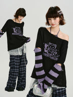 Full outfit shot showing the sweater paired with plaid pants