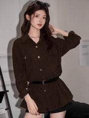 Woman posing in a brown corduroy shirt dress