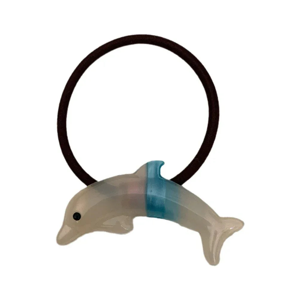 Translucent dolphin hair tie with a blue accent Main image