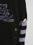 Detail of the striped sleeves and cut-out on the sweater