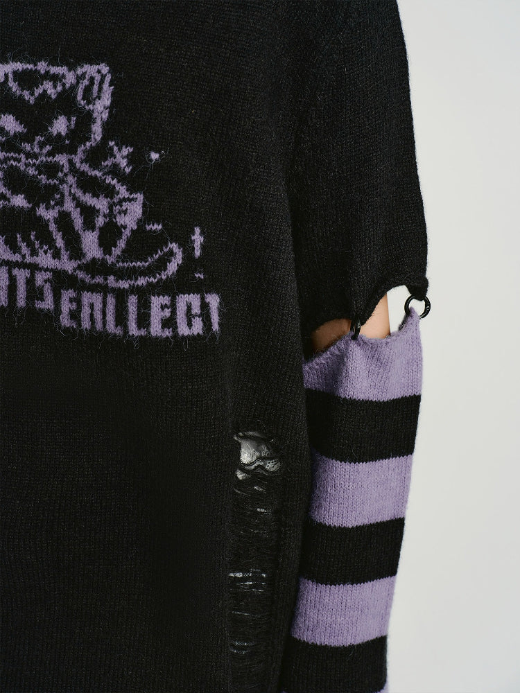 Detail of the striped sleeves and cut-out on the sweater