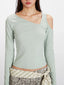 Front view focusing on the neckline and upper torso of the mint green long-sleeved shirt with its unique asymmetrical design.