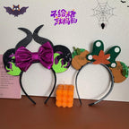 Two Halloween themed headbands, one with devil horns and a purple bow, the other with pumpkin and leaf accents.