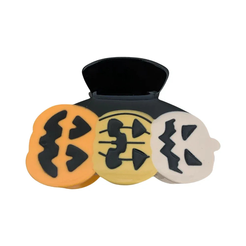 Halloween themed hair clip with three jack-o'-lanterns