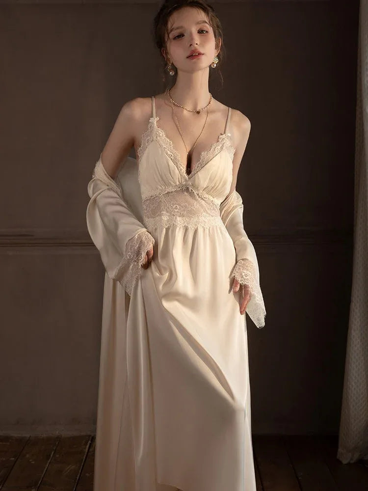 Woman posing in a cream satin nightgown and robe.