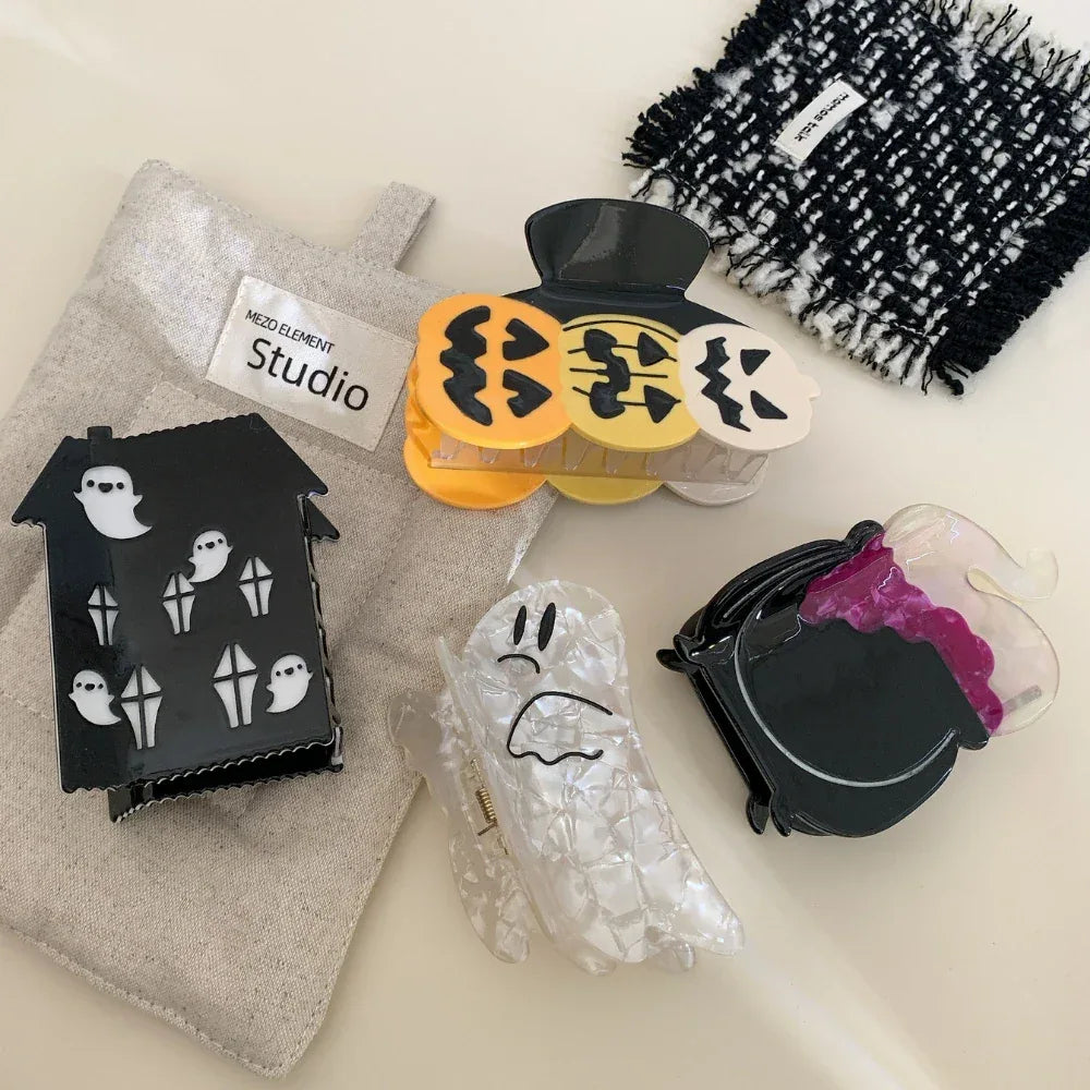 Assortment of Halloween themed hair accessories on a light-colored surface