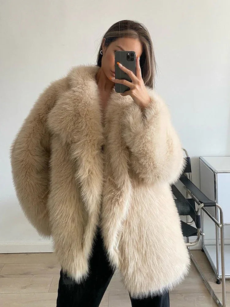 woman wearing a beige faux fur coat Main image
