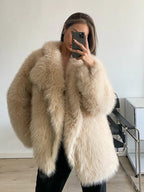 woman wearing a beige faux fur coat