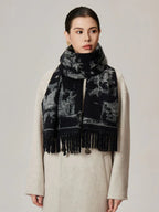 Woman wearing a black and white patterned scarf draped over a cream coat
