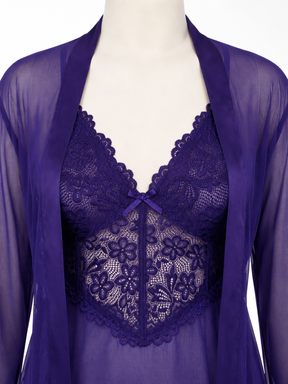 Close-up of the purple lace bralette with a bow detail, worn under a sheer robe.