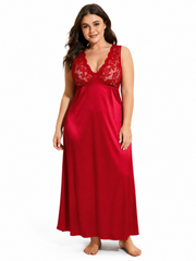 Woman posing in a red lace-trimmed satin nightgown