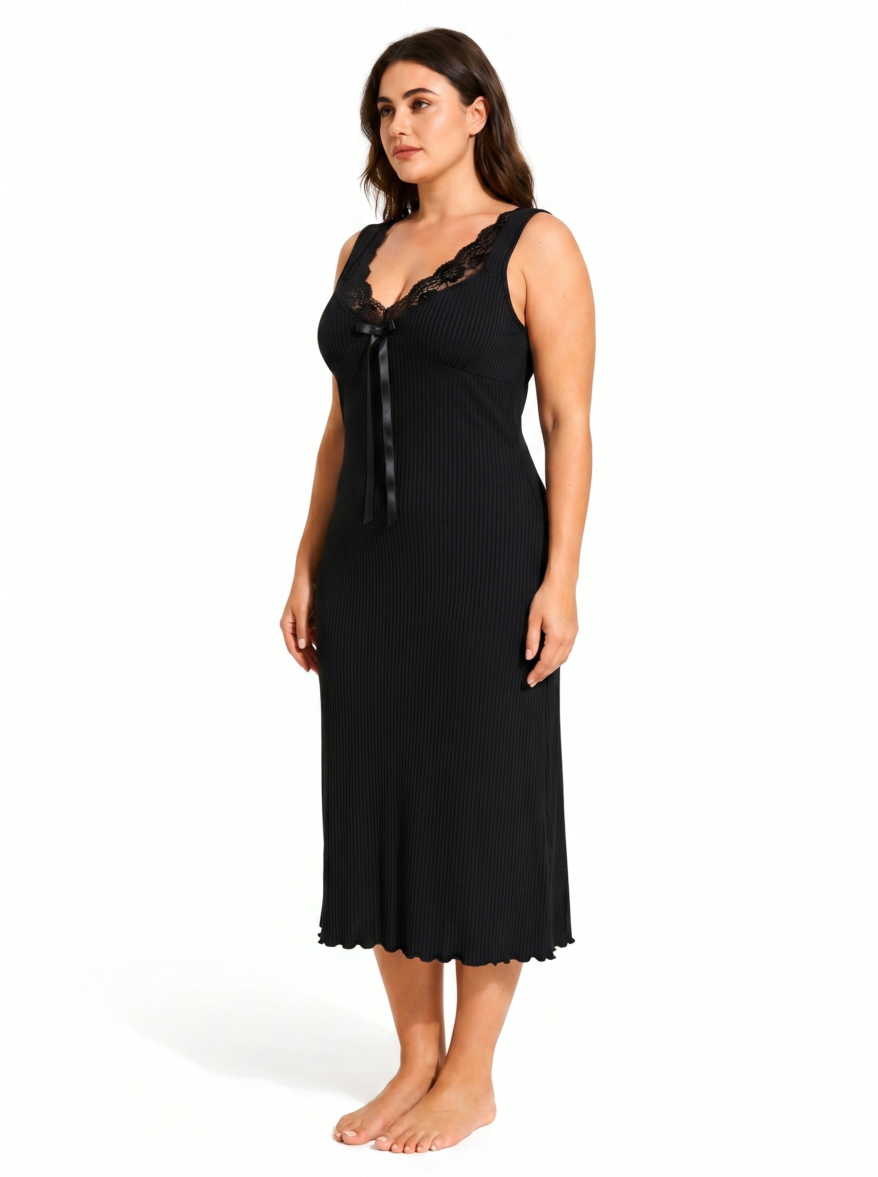 Side profile of a woman wearing a black ribbed knit nightgown