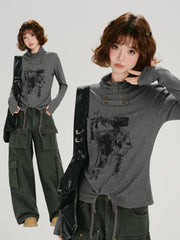Collage showing a woman in a grey long-sleeve graphic print turtleneck top and another image of the full outfit including dark green cargo pants.