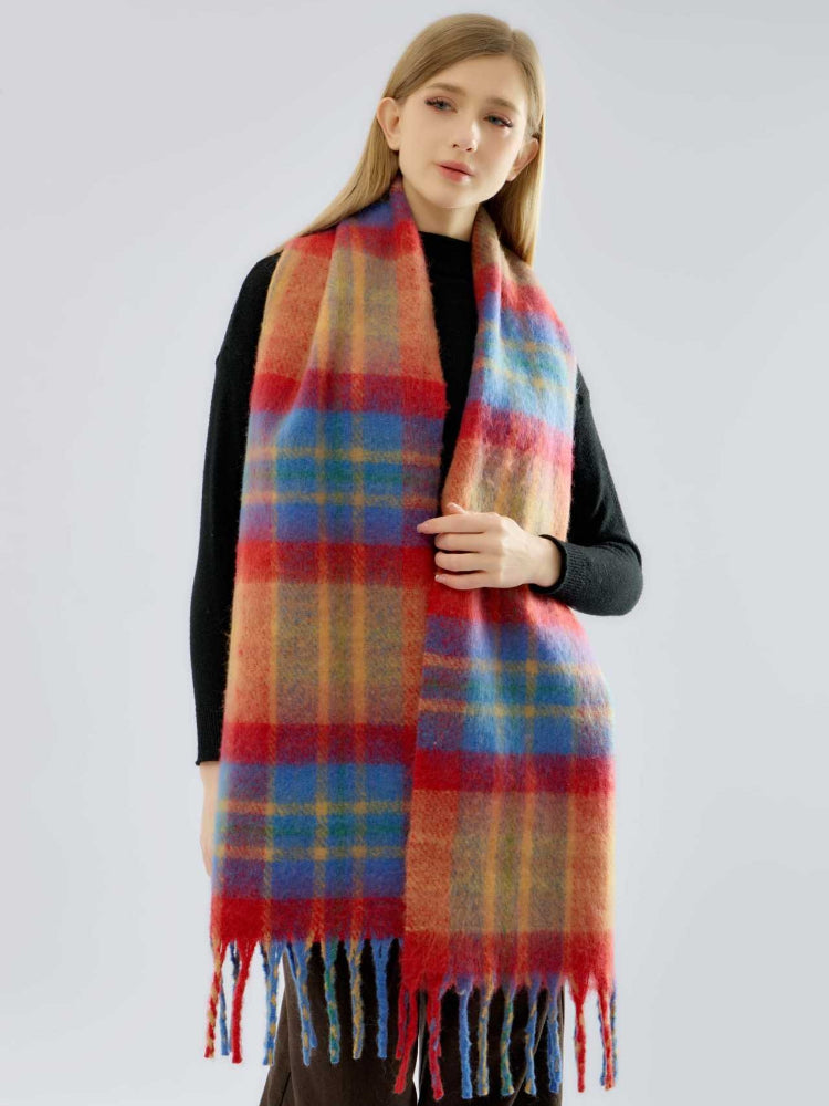 Woman wearing a long, multi-colored plaid scarf