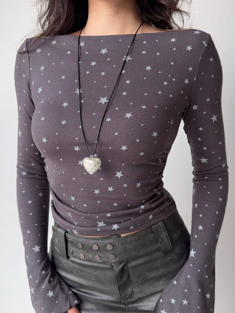Close-up of a grey long-sleeve top with a white star print.