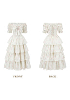 Front view of a white floral print off-the-shoulder tiered dress with puffed sleeves and a bow detail