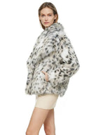 side view of a woman in a dalmatian print faux fur cropped jacket