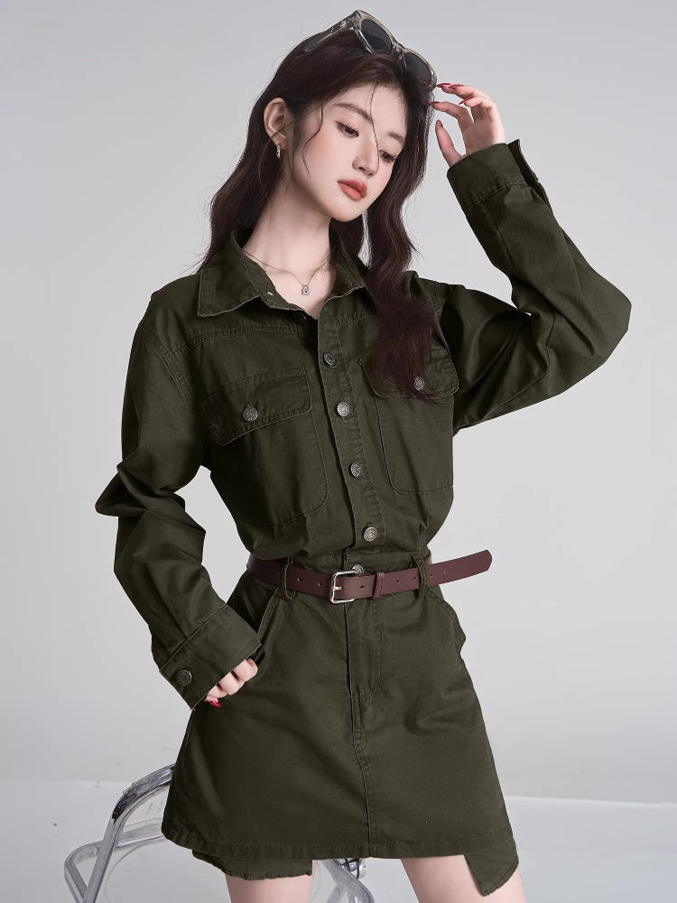 Close-up of a woman in a green shirt and skirt set, styled with a brown belt