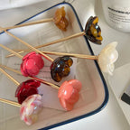 close-up of flower hairpins in a tray