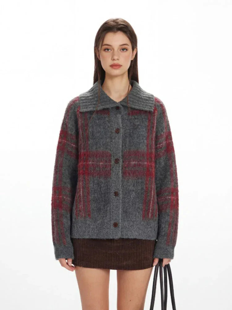 Close-up of the grey plaid knit jacket with a spread collar and button closure.