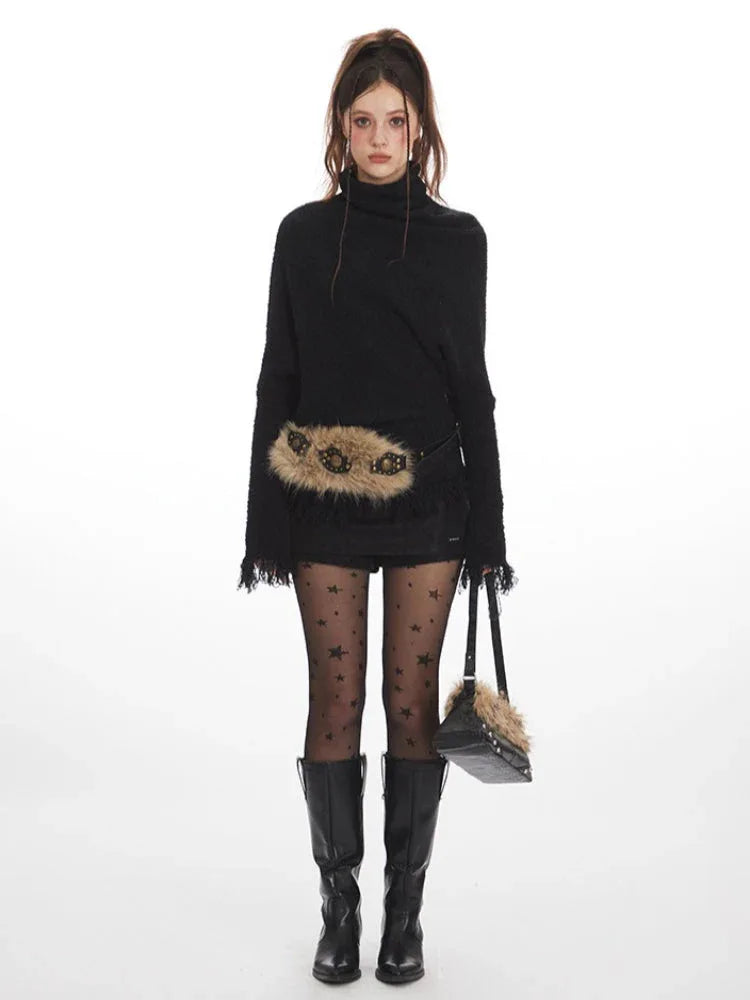 Woman wearing a black turtleneck sweater with fringe details, a fur-trimmed belt, star pattern hosiery, and black boots. Main image