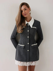 Young woman wearing a grey tweed mini dress with a white collar and lace trim