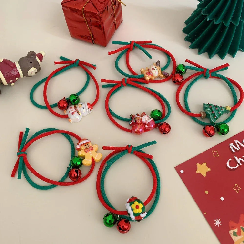 Various Christmas hair ties featuring holiday characters and jingle bells