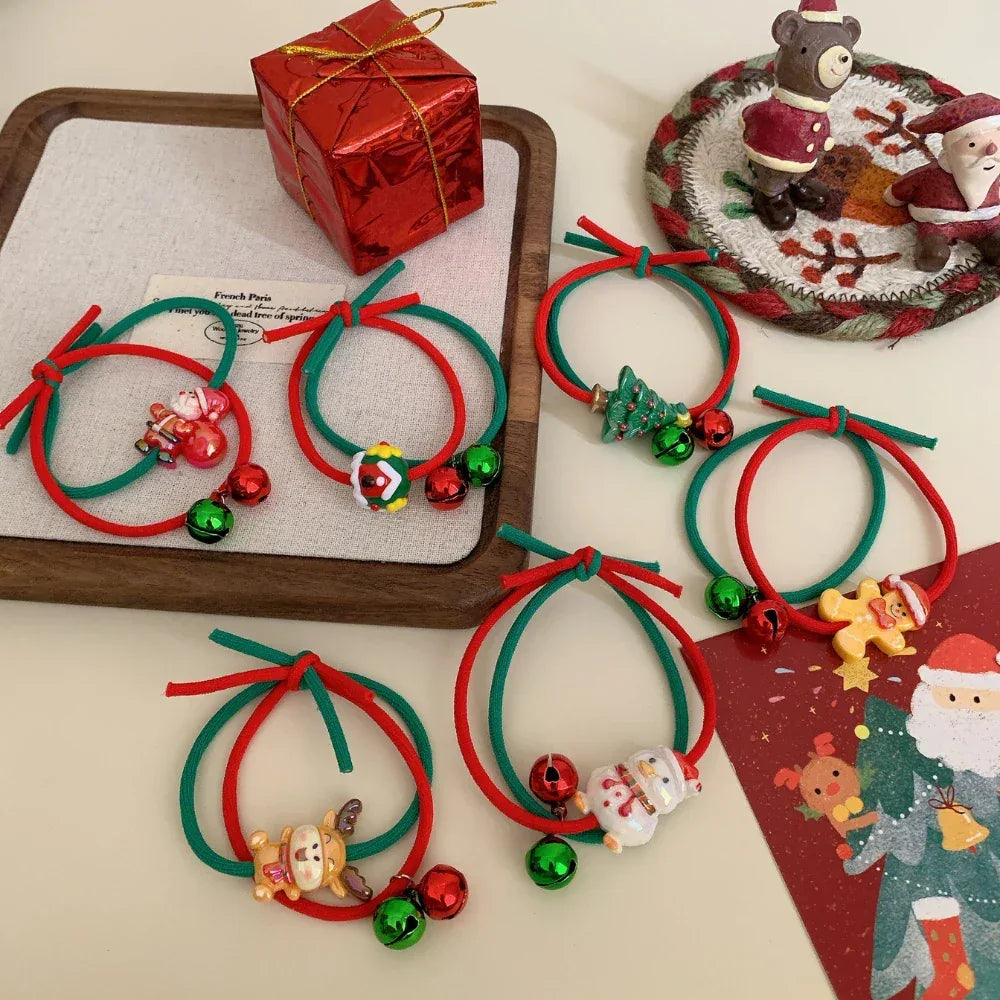 Collection of Christmas-themed hair ties with various charms and bells