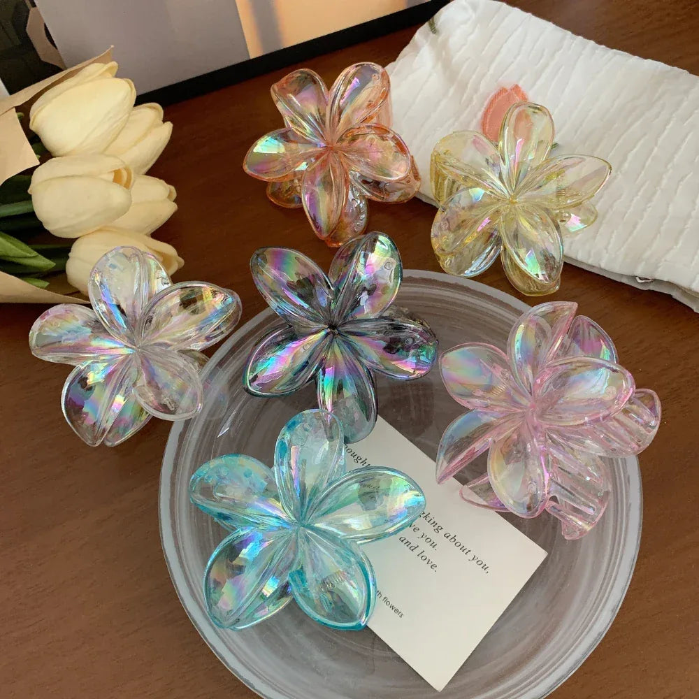 collection of iridescent flower claw hair clips in various colors