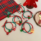 Set of red and green Christmas hair ties adorned with festive charms and bells