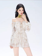 Woman wearing a floral print off-the-shoulder mini dress with bell sleeves and a green floral choker.