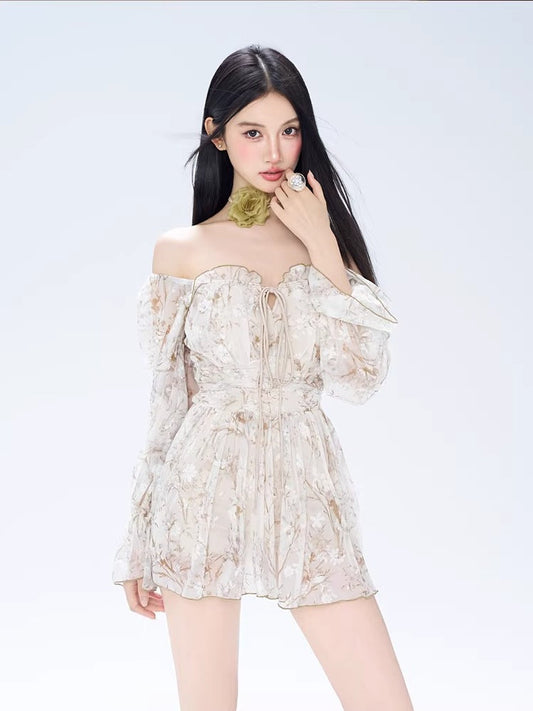 Woman wearing a floral print off-the-shoulder mini dress with bell sleeves and a green floral choker.