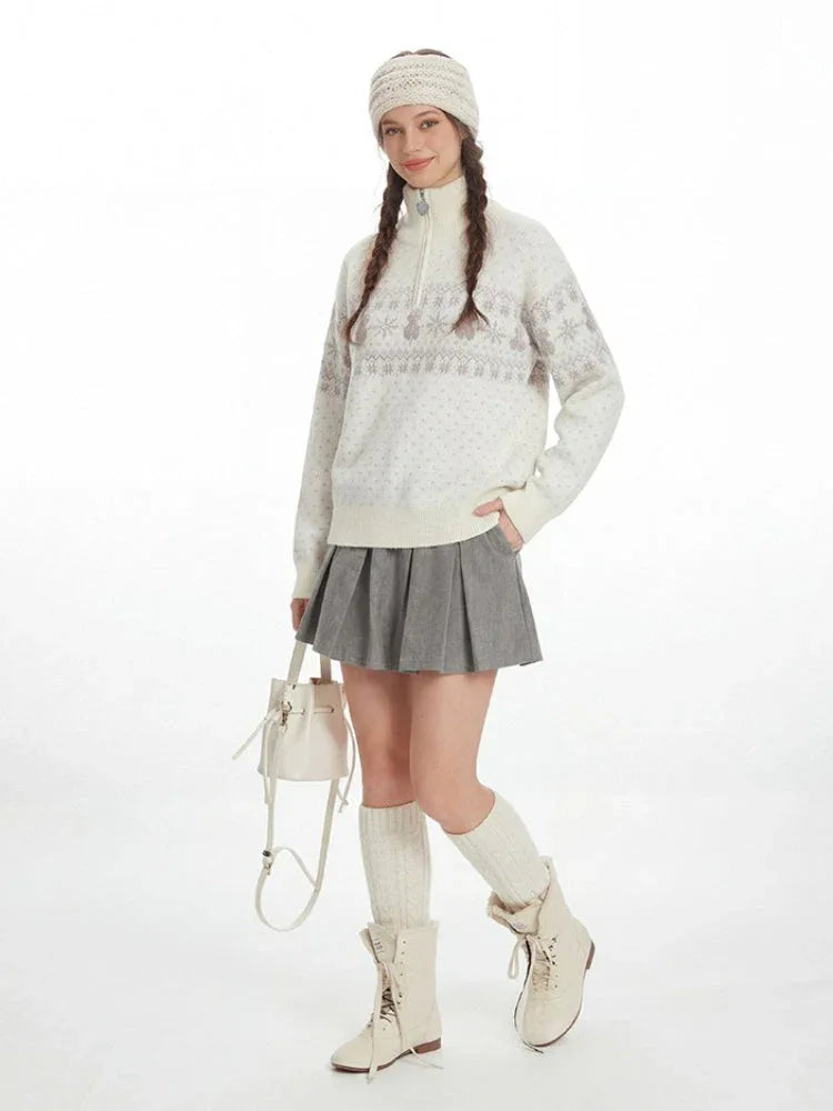 Full-body shot of a model in a winter-themed outfit, including a patterned sweater, pleated skirt, and tall socks. Secondary image