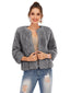 Woman wearing a grey faux fur jacket over a light-colored top and ripped jeans.