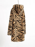 Back view of a hooded faux fur tiger print long coat hanging on a hanger.