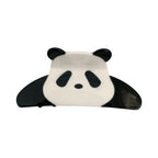 A black and white panda hair claw clip