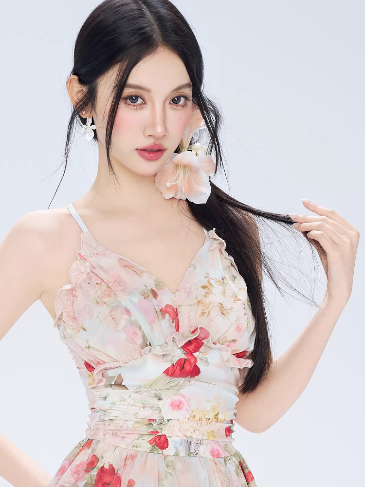Close-up of a woman wearing a floral print mini dress with ruffled neckline