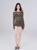 Full body shot of the model in the sheer striped cover-up and bikini