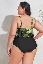Back view of plus-size tankini swimsuit with camouflage print ruffled top and black ruched bottom