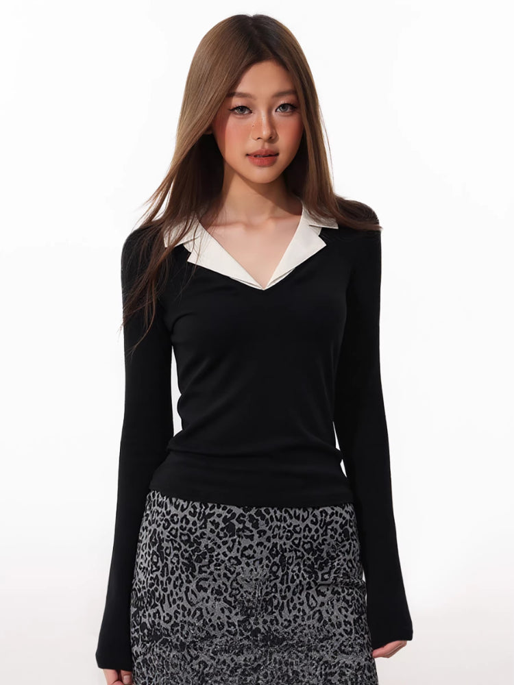Model wearing a black long-sleeved top with a white contrast collar and a leopard print skirt.