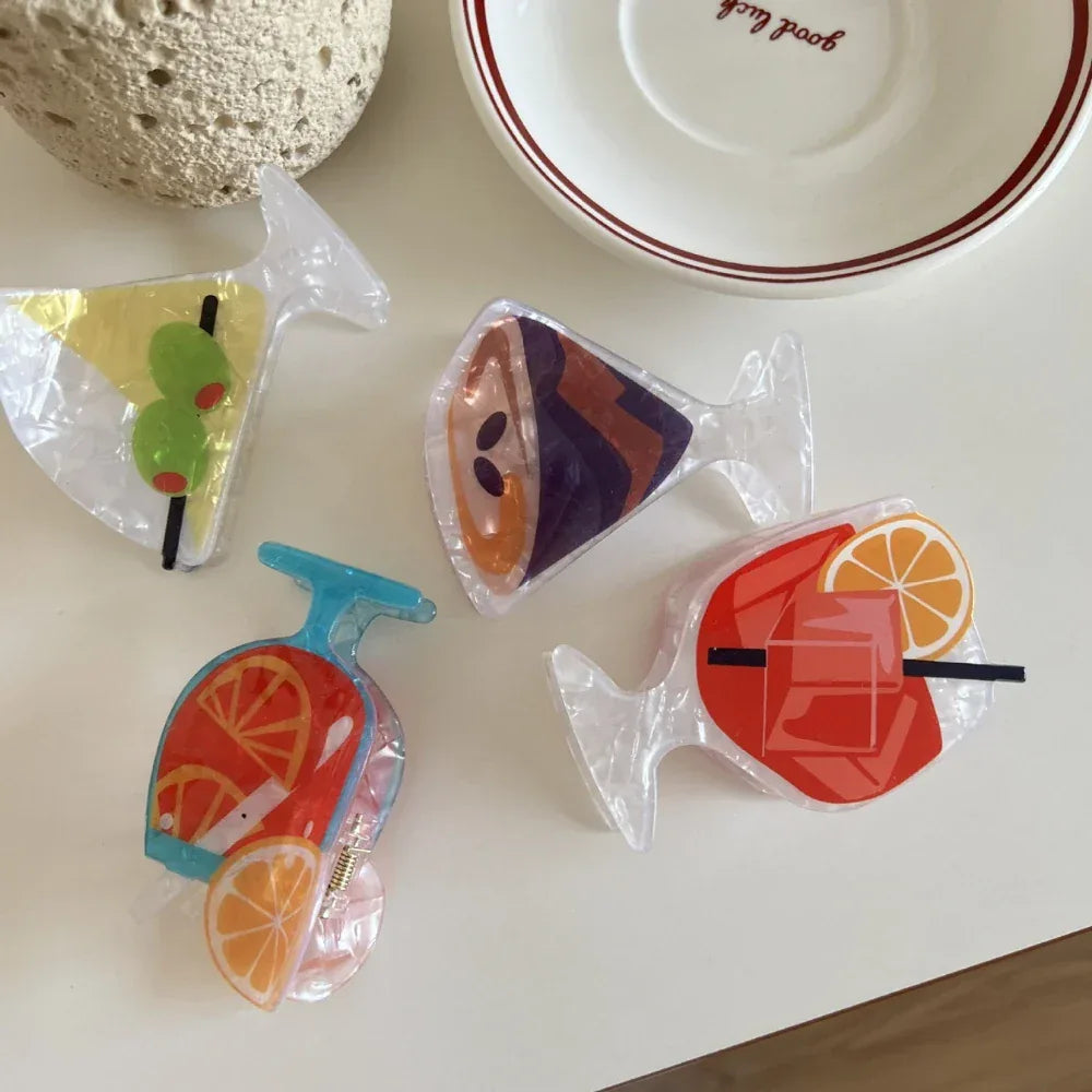 collection of acrylic cocktail hair clips in various designs including martini, orange cocktail, and red cocktail