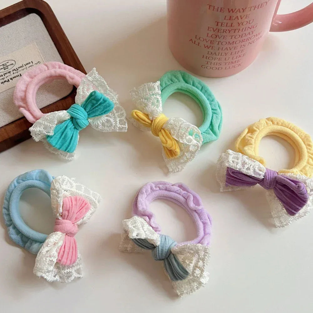 Collection of colorful scrunchies with bows and lace trim