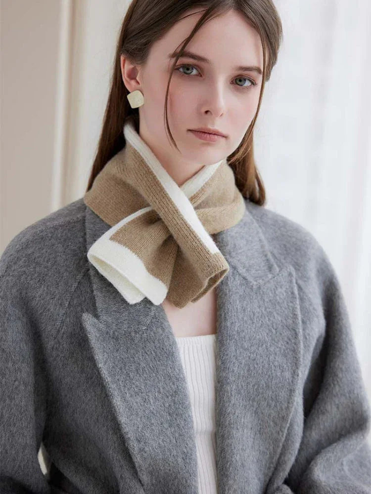 Close-up of a woman wearing a striped knit scarf