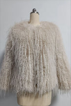 Light beige faux fur jacket with a shaggy, fringed texture displayed on a mannequin.