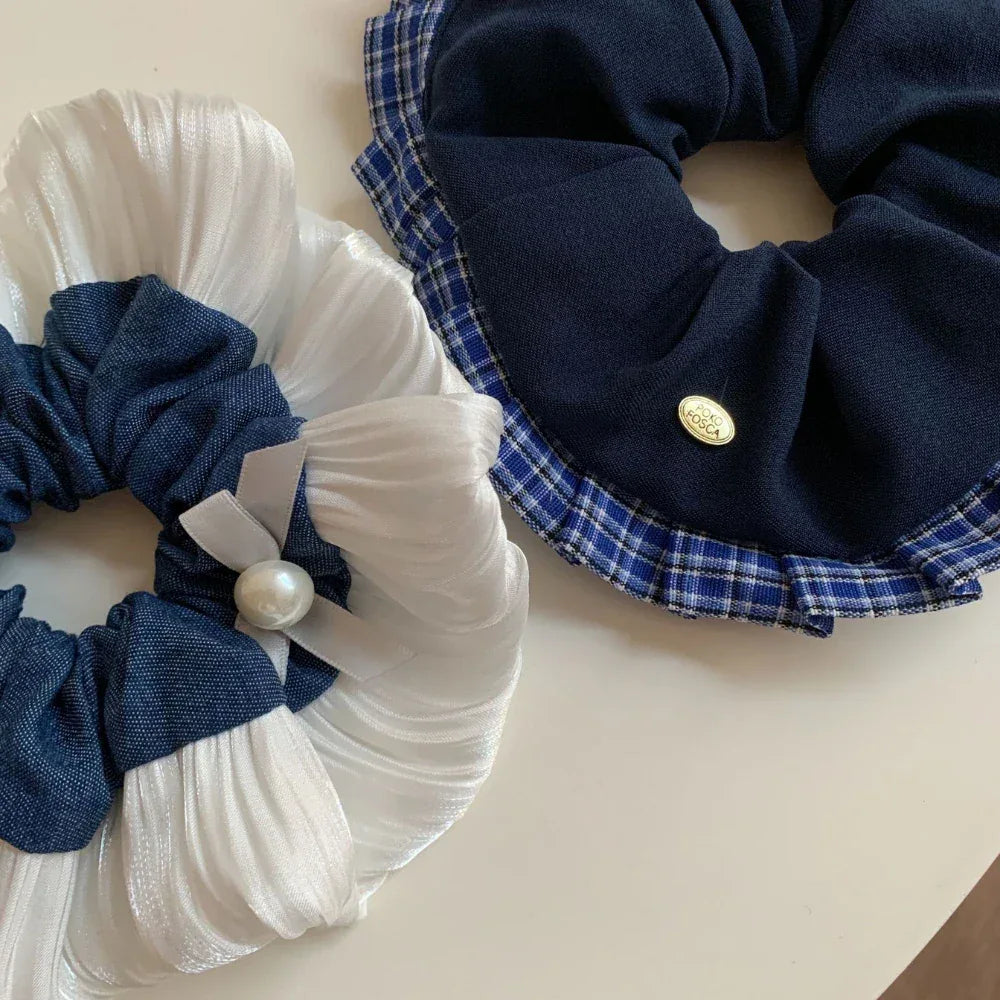 Detailed view of the fabric and embellishments on the scrunchies