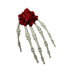 Skeleton hand hair clip with red flower