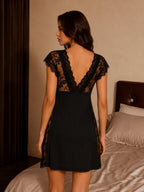 Back view of a black lace trim nightdress on a model